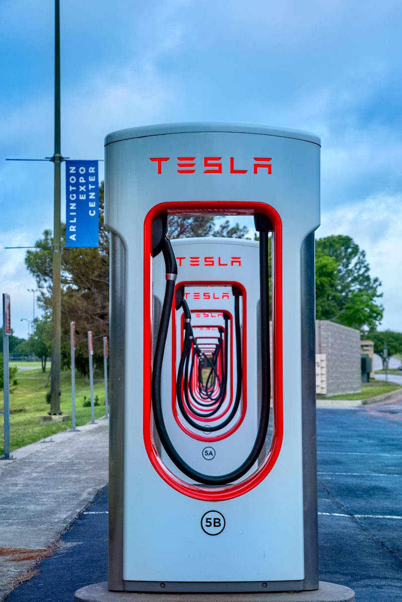 a tesla charging station on the side of the road