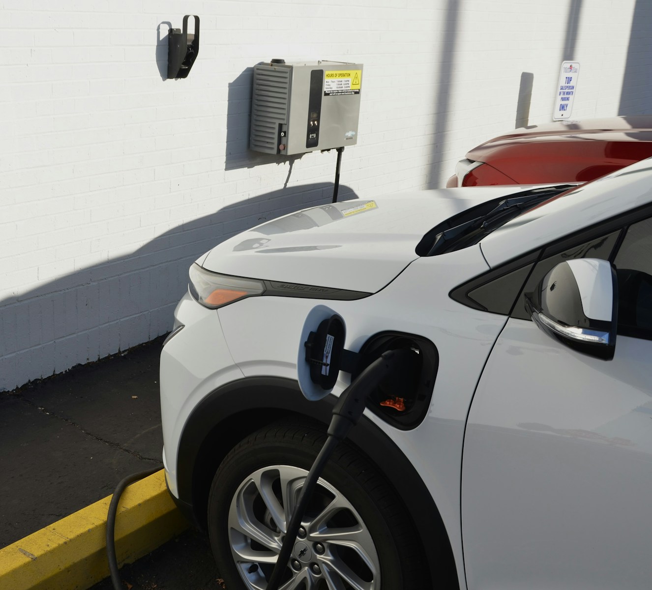 An electric car plugged into a charging station