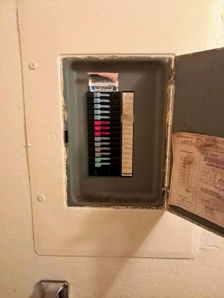 Old breaker panel photographed by Volta Electric before an upgrade
