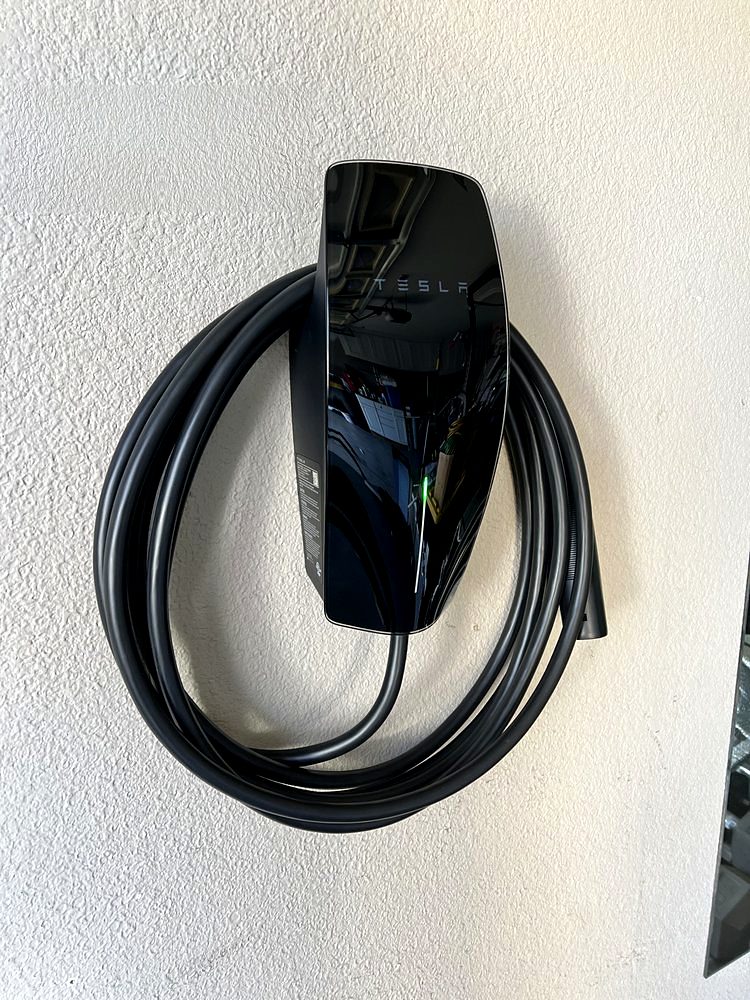 Black Tesla Wall Connector installed by Volta Electric