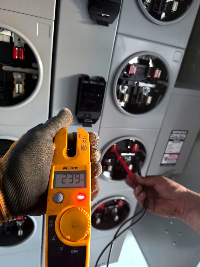 Volta Electric electrician checking voltage at a meter socket