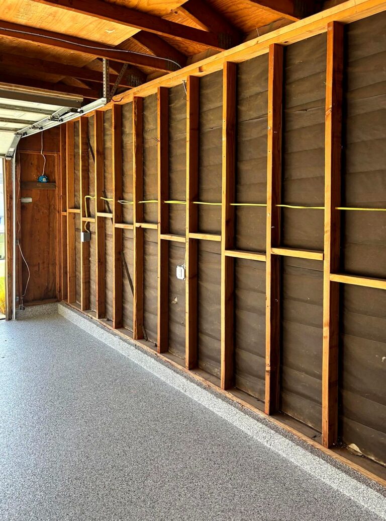 Garage with open stud walls and new circuit wiring for added outlets