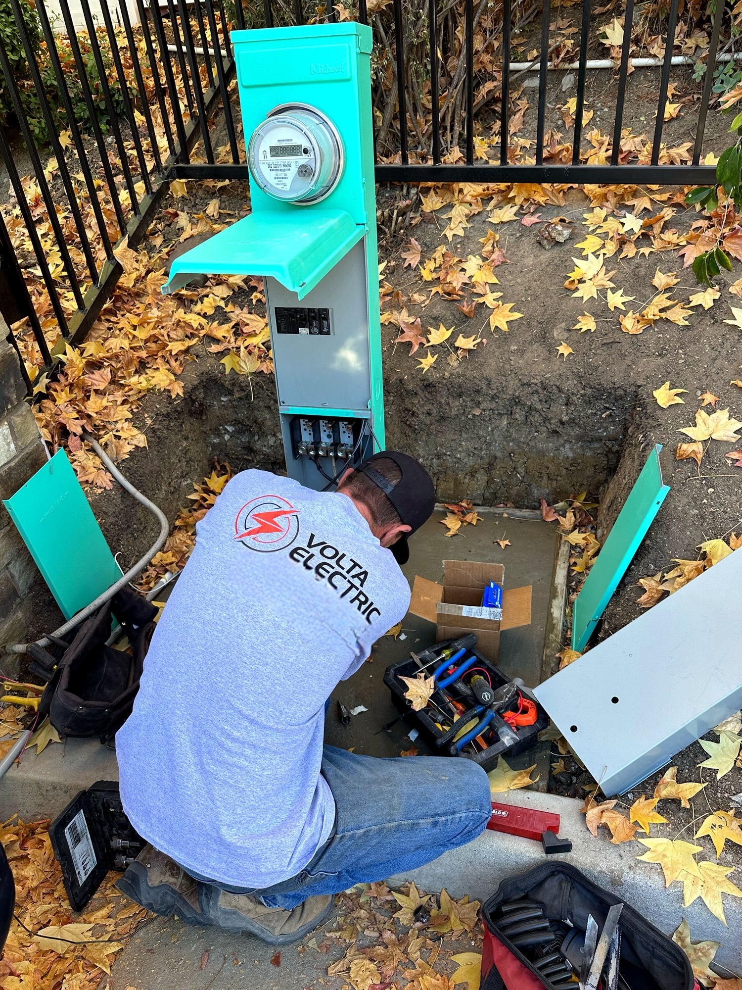 Volta Electric technician installing a meter panel with a new underground feed