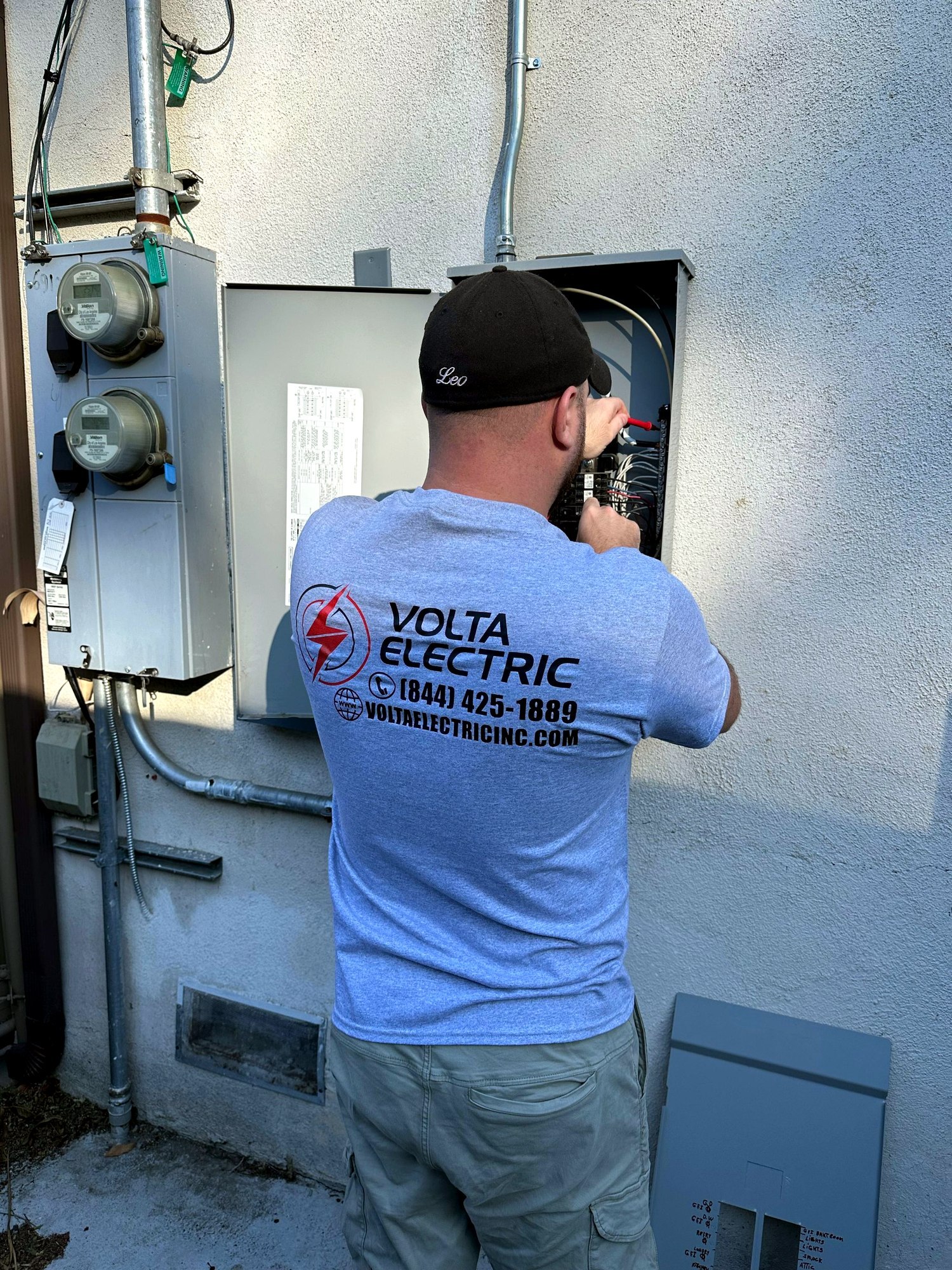 Volta Electric technician labeling breakers after a panel upgrade